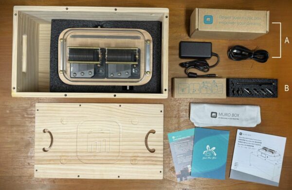 The design of the N40 music box incorporates the resonance box as the shipping container for the product, allowing for the storage of all the accessories needed for using the music box inside the resonance box.