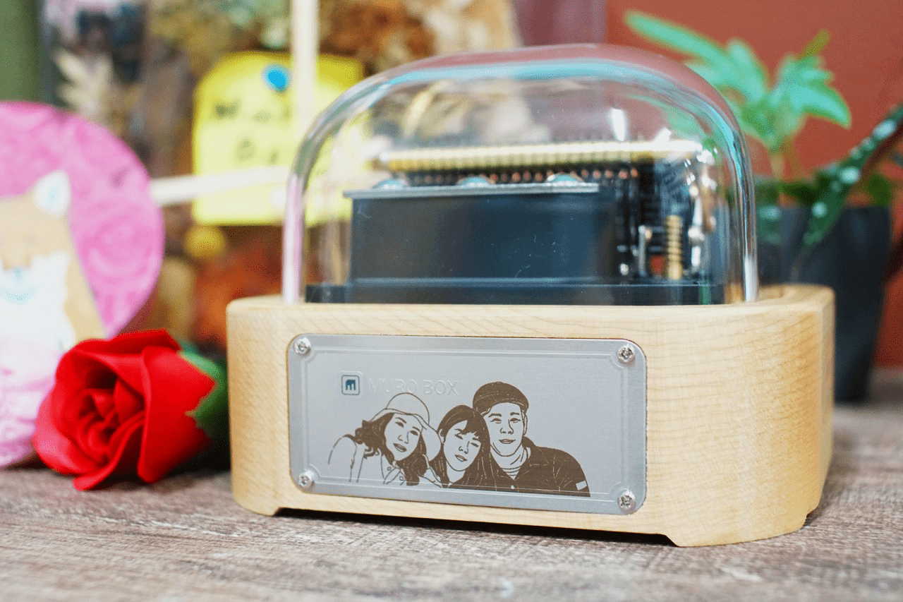 Laser Engraving on Metal Plates -Mr. Yang chose a family photo for the front laser engraving on the app-controlled and programmable Music Box in the World.