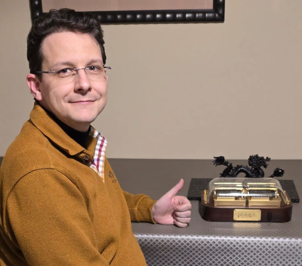 Siegfried, a Belgian customer of the Muro Box-N40 Sublime Music Box, posing with his collection.